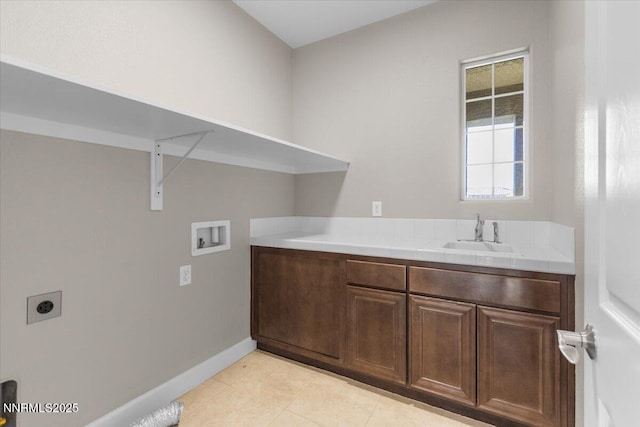 2675 Weymoor Ct, Reno, NV 89521 - laundry room with hookup for a washing machine, hookup for an electric dryer, baseboards, cabinet space, and light tile patterned floors