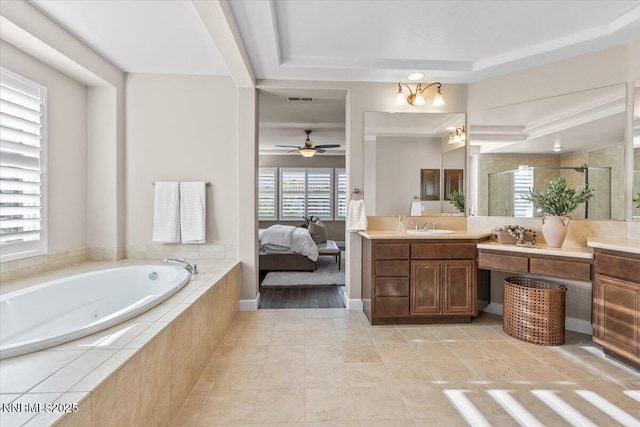 2675 Weymoor Ct, Reno, NV 89521 - full bath featuring vanity, a jetted tub, a stall shower, tile patterned floors, and a ceiling fan