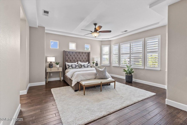 2675 Weymoor Ct, Reno, NV 89521 - bedroom with dark wood-style floors, baseboards, a ceiling fan, and a raised ceiling