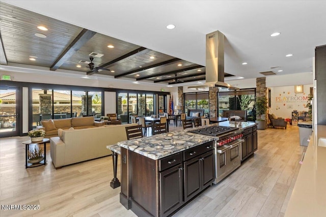 2675 Weymoor Ct, Reno, NV 89521 - kitchen featuring open floor plan, range with two ovens, beamed ceiling, a breakfast bar area, and ceiling fan