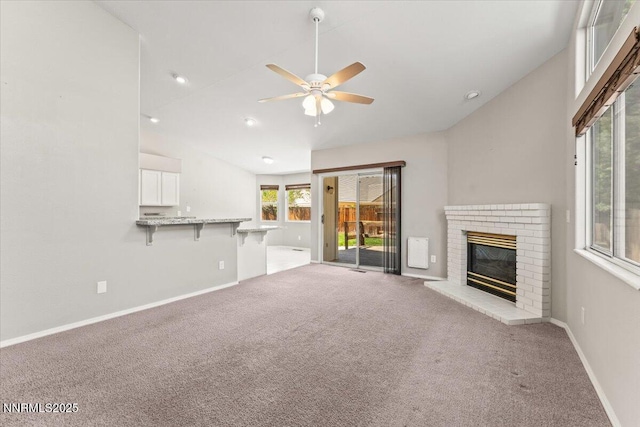 4515 Vista Mountain Dr, Sparks, NV 89436 - unfurnished living room with lofted ceiling, ceiling fan, carpet flooring, a fireplace, and baseboards