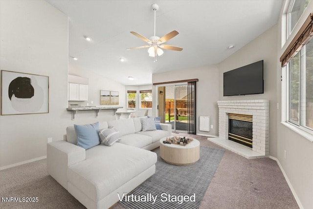 4515 Vista Mountain Dr, Sparks, NV 89436 - living area featuring lofted ceiling, carpet flooring, ceiling fan, a brick fireplace, and baseboards