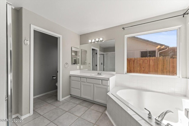 4515 Vista Mountain Dr, Sparks, NV 89436 - full bath featuring a garden tub, vanity, tile patterned flooring, toilet, and baseboards