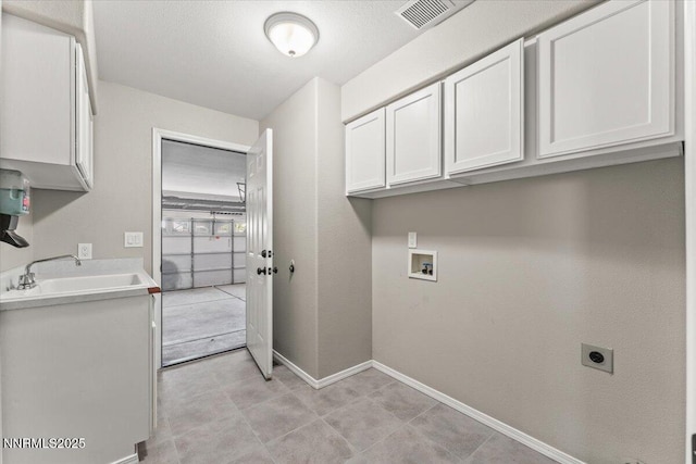 4515 Vista Mountain Dr, Sparks, NV 89436 - laundry room with cabinet space, hookup for an electric dryer, baseboards, and hookup for a washing machine