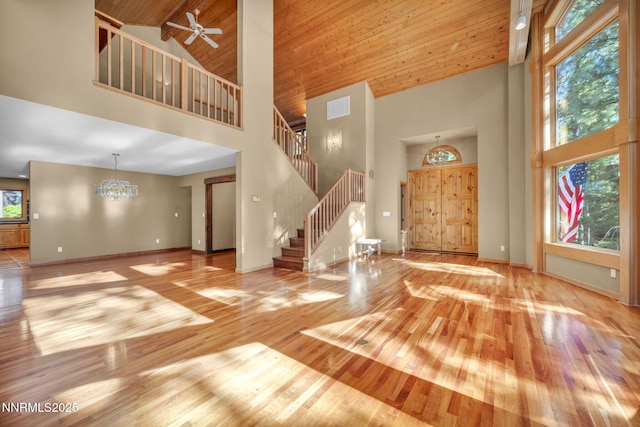 1445 Austrian Pine Rd, Reno, NV 89511 - foyer entrance with high vaulted ceiling, wood finished floors, stairs, baseboards, and wood ceiling