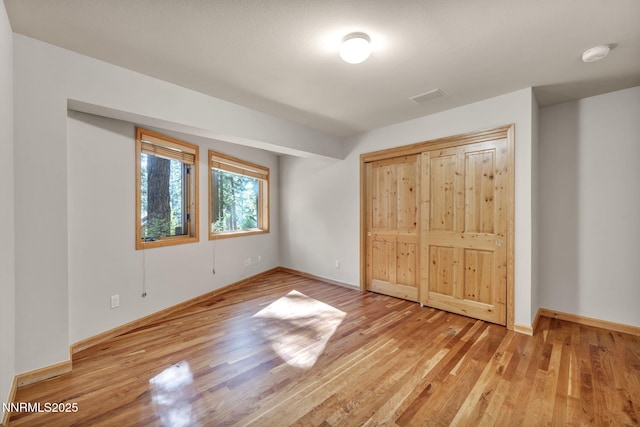 1445 Austrian Pine Rd, Reno, NV 89511 - unfurnished bedroom featuring wood finished floors and baseboards