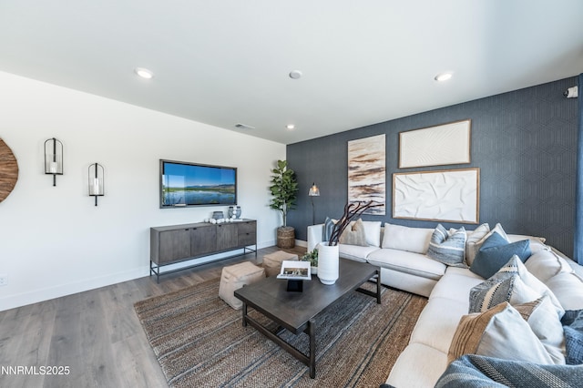 7609 Apex Pl # 113, Reno, NV 89506 - living area featuring baseboards, an accent wall, wood finished floors, and recessed lighting