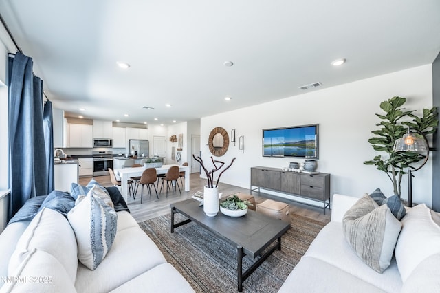 7609 Apex Pl # 113, Reno, NV 89506 - living area with light wood-type flooring and recessed lighting