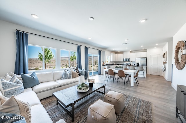 7609 Apex Pl # 113, Reno, NV 89506 - living area featuring light wood finished floors and recessed lighting