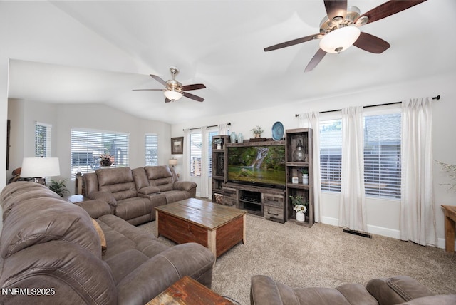 240 Mary Lou Ln, Fernley, NV 89408 - carpeted living area with a ceiling fan, vaulted ceiling, and baseboards