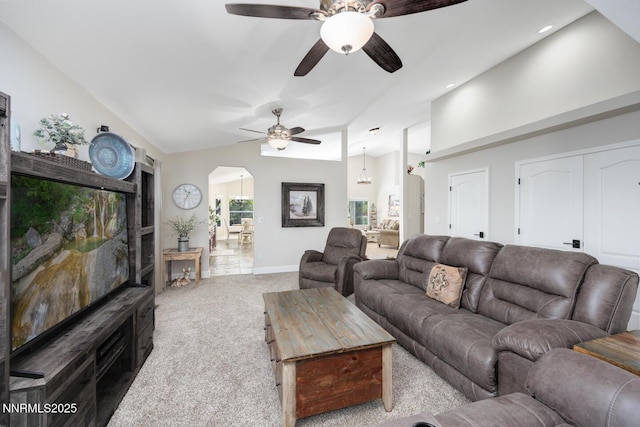 240 Mary Lou Ln, Fernley, NV 89408 - carpeted living room with arched walkways, ceiling fan, vaulted ceiling, and baseboards