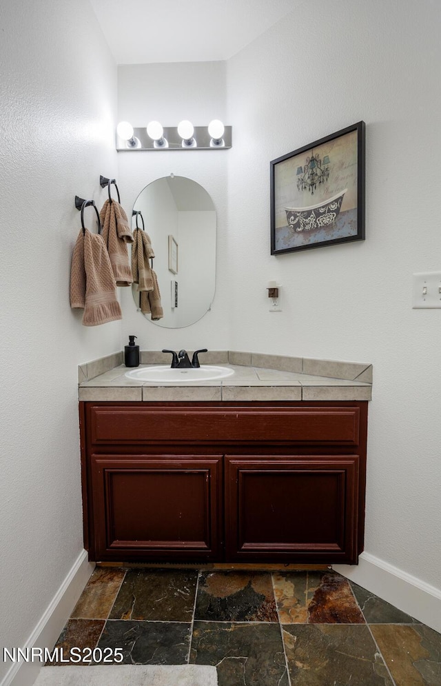 240 Mary Lou Ln, Fernley, NV 89408 - bathroom with stone tile flooring, baseboards, and vanity