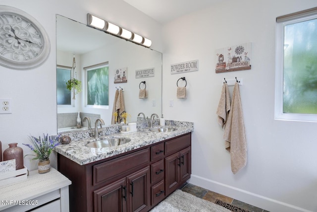 240 Mary Lou Ln, Fernley, NV 89408 - bathroom featuring double vanity and baseboards