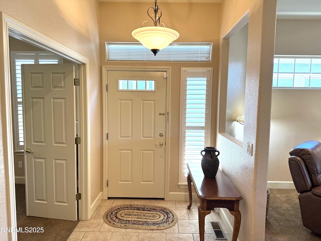 6680 Aston Cir, Sparks, NV 89436 - entryway featuring light tile patterned floors and baseboards
