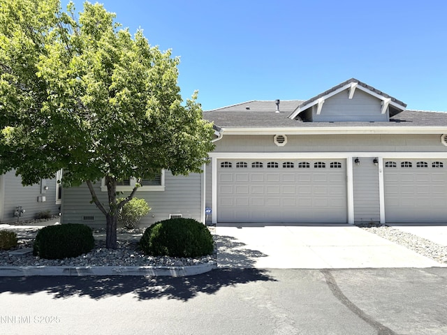 6680 Aston Cir, Sparks, NV 89436 - view of front of home with an attached garage, driveway, and a shingled roof