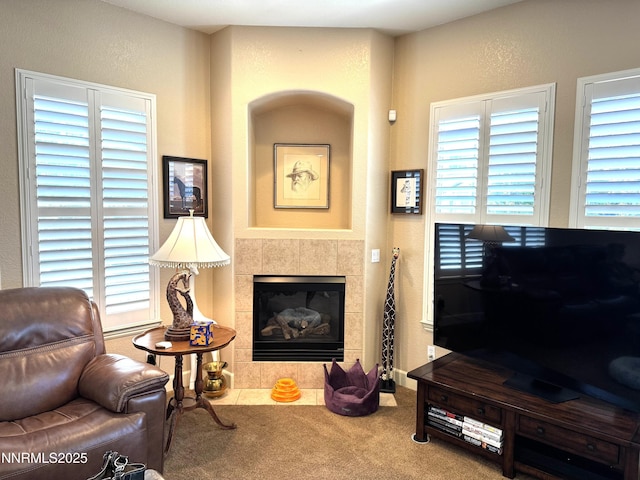 6680 Aston Cir, Sparks, NV 89436 - living area featuring carpet, a tiled fireplace, and a textured wall