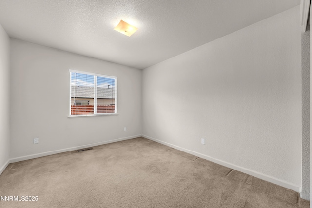 17330 Desert Lake Dr, Reno, NV 89508 - empty room with light carpet, baseboards, and a textured ceiling