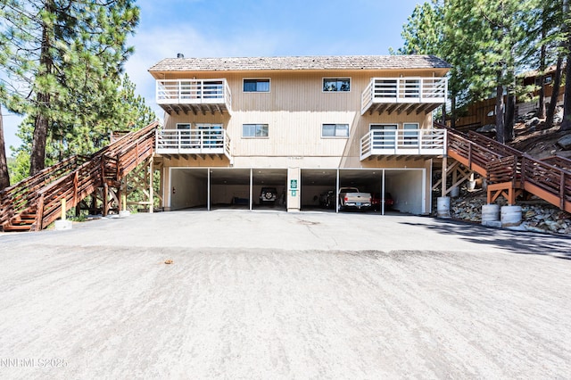 769 Tina Ct # H, Stateline, NV 89449 - rear view of property with stairs, driveway, and a carport