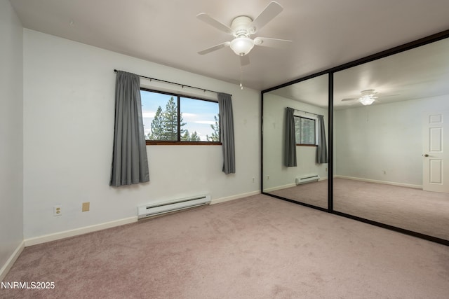 769 Tina Ct # H, Stateline, NV 89449 - unfurnished bedroom featuring a baseboard heating unit, carpet floors, and multiple windows