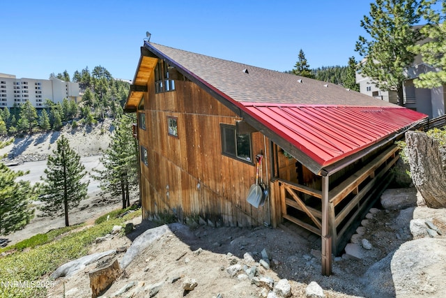383 Tramway Dr Unit B, Stateline, NV 89449 - rear view of property featuring a shingled roof and metal roof