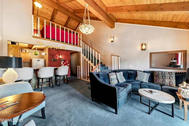383 Tramway Dr Unit B, Stateline, NV 89449 - living room with wooden ceiling with exposed beams, carpet, stairs, a chandelier, and high vaulted ceiling