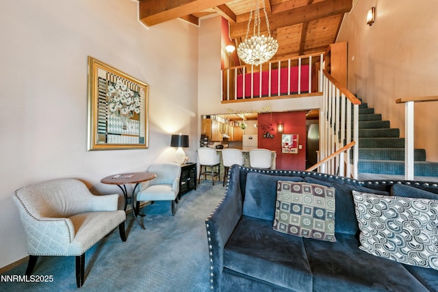 383 Tramway Dr Unit B, Stateline, NV 89449 - living area with wood ceiling with exposed beams, high vaulted ceiling, a chandelier, carpet, and stairway