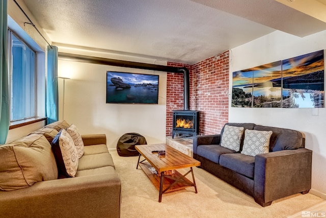 758 Milky Way Ct Unit B, Stateline, NV 89449 - living area featuring a wood stove, light carpet, baseboards, and a textured ceiling
