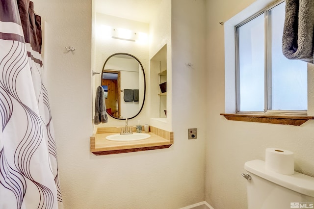 758 Milky Way Ct Unit B, Stateline, NV 89449 - bathroom with a sink, toilet, built in shelves, and baseboards