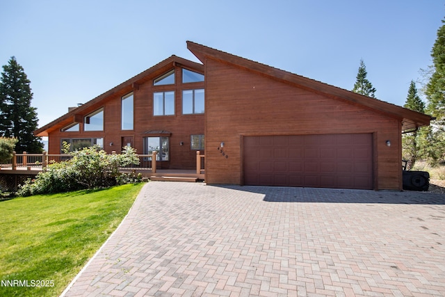 4360 Slide Mountain Cir, Reno, NV 89511 - view of front facade with decorative driveway, a deck, and a front yard