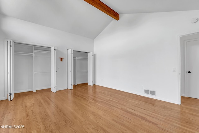 4360 Slide Mountain Cir, Reno, NV 89511 - unfurnished bedroom featuring light wood-style flooring, two closets, and baseboards