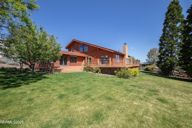 4360 Slide Mountain Cir, Reno, NV 89511 - rear view of property featuring a chimney, a deck, and a yard