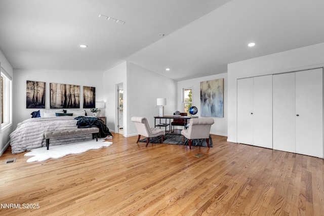 4360 Slide Mountain Cir, Reno, NV 89511 - bedroom featuring lofted ceiling, light wood-style flooring, a closet, recessed lighting, and baseboards