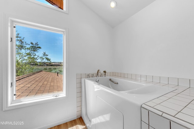 4360 Slide Mountain Cir, Reno, NV 89511 - laundry area featuring plenty of natural light and wood finished floors