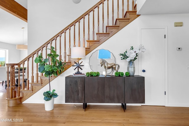 4360 Slide Mountain Cir, Reno, NV 89511 - stairway with wood finished floors, baseboards, and a towering ceiling