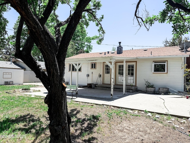604 W Winnie Ln, Carson City, NV 89703 - back of house featuring a patio and a chimney