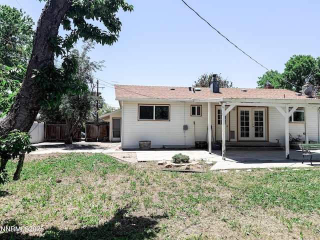 604 W Winnie Ln, Carson City, NV 89703 - rear view of house with french doors, a patio area, and a chimney