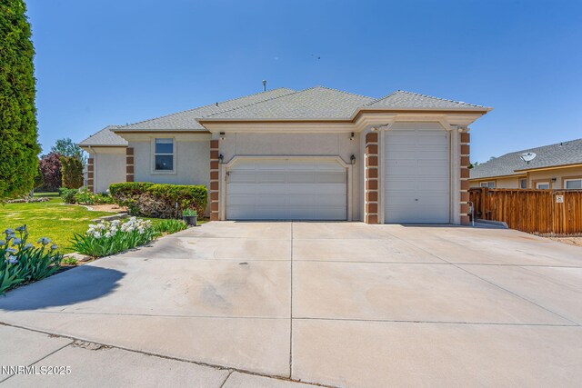 627 Wedge Ln, Fernley, NV 89408 - ranch-style home featuring driveway, a garage, and stucco siding