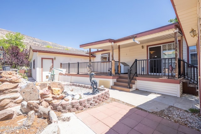 244 Ave De La Couleurs Ave, Sparks, NV 89434 - covered porch with a mountain view