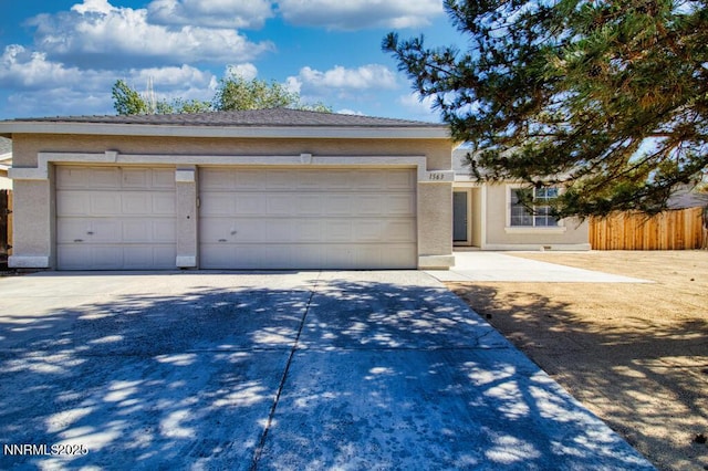 1563 Maria Ct, Fernley, NV 89408 - ranch-style house featuring concrete driveway, stucco siding, and a garage