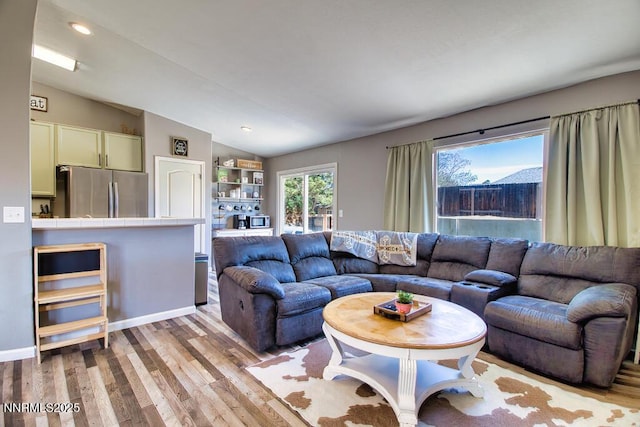 1563 Maria Ct, Fernley, NV 89408 - living area with vaulted ceiling, light wood-style floors, and recessed lighting