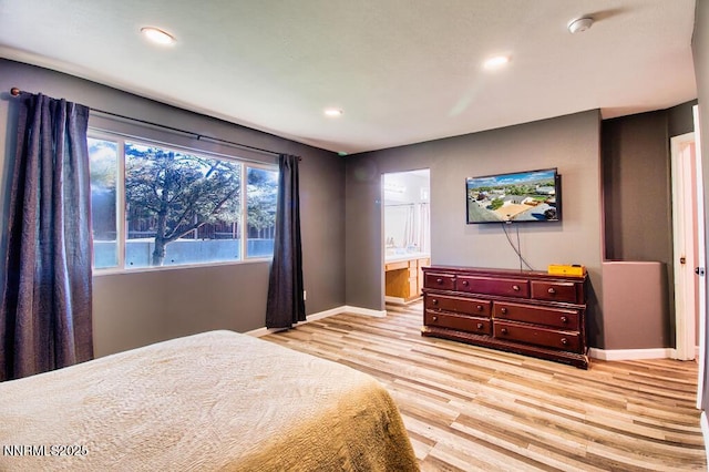 1563 Maria Ct, Fernley, NV 89408 - bedroom with baseboards, light wood-type flooring, recessed lighting, and connected bathroom