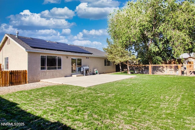 1563 Maria Ct, Fernley, NV 89408 - rear view of property with solar panels, a patio area, stucco siding, and roof with shingles