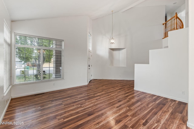 3095 Fairwood Dr, Reno, NV 89502 - unfurnished living room with high vaulted ceiling, stairway, wood finished floors, and baseboards