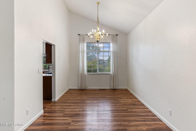 3095 Fairwood Dr, Reno, NV 89502 - unfurnished dining area with a chandelier, dark wood-style flooring, lofted ceiling, and baseboards