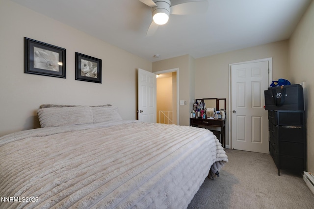 4930 Catalina Dr Apt 3, Reno, NV 89502 - bedroom featuring light colored carpet, a baseboard heating unit, and ceiling fan