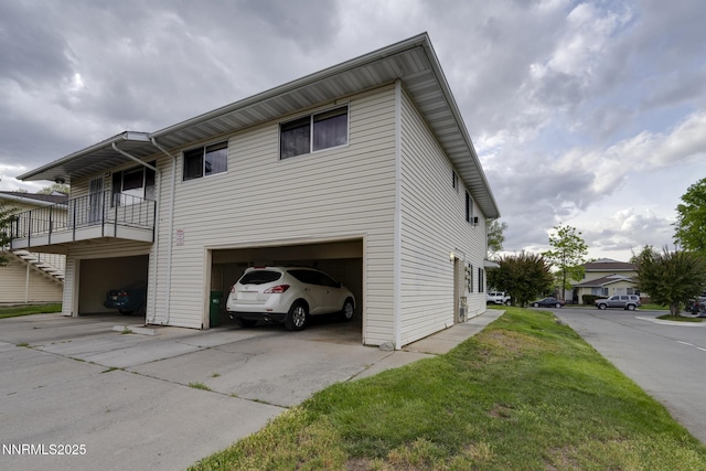 4930 Catalina Dr Apt 3, Reno, NV 89502 - view of home's exterior with a garage, concrete driveway, and a yard