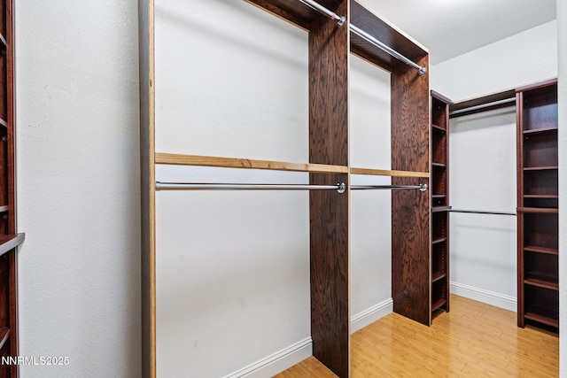 11285 Messina Way, Reno, NV 89521 - spacious closet featuring wood finished floors