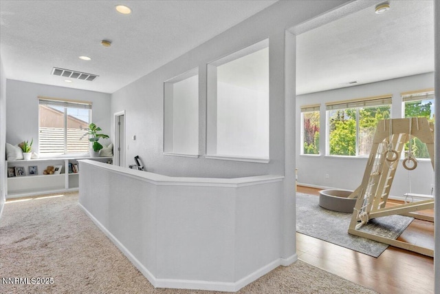 2349 Dodge Dr, Sparks, NV 89436 - hallway with baseboards, recessed lighting, carpet flooring, and a textured ceiling