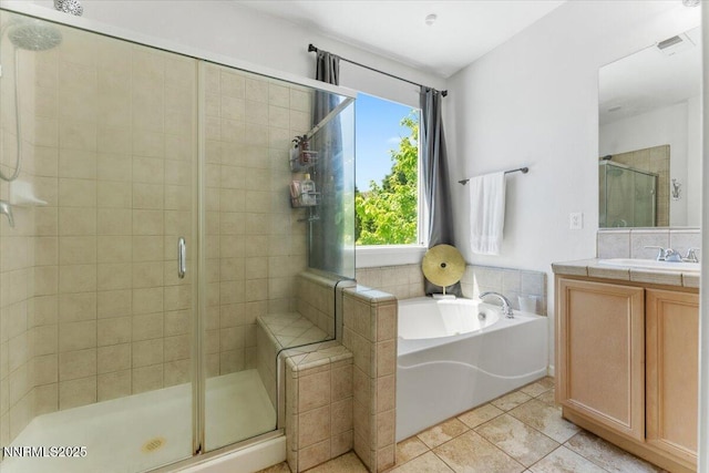 2349 Dodge Dr, Sparks, NV 89436 - full bathroom featuring a shower stall, a garden tub, vanity, and tile patterned floors