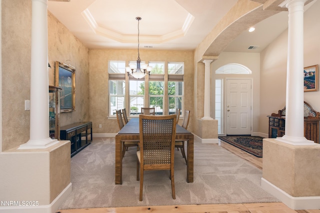1601 Jones St, Minden, NV 89423 - dining room with ornate columns, arched walkways, baseboards, a chandelier, and crown molding